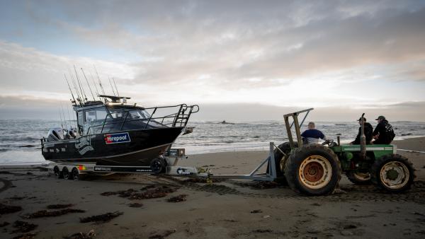 Beach launching with the tractor on the rugged Wairarapa coast